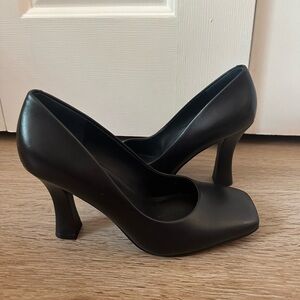 Black leather pumps